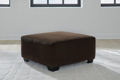 Kimlee - Sectional And Ottoman Set