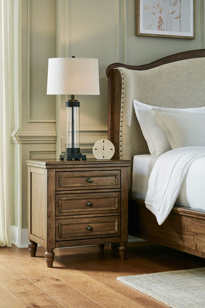 Sturlayne - Three Drawer Night Stand - Brown